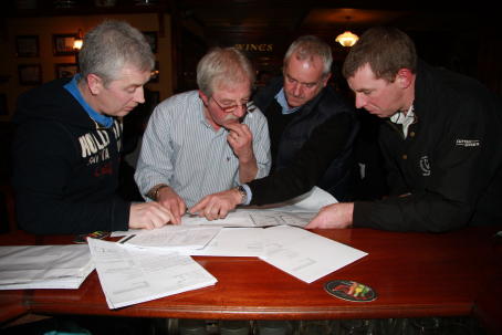 pouring-over-the-plans pouring-over-the-plans